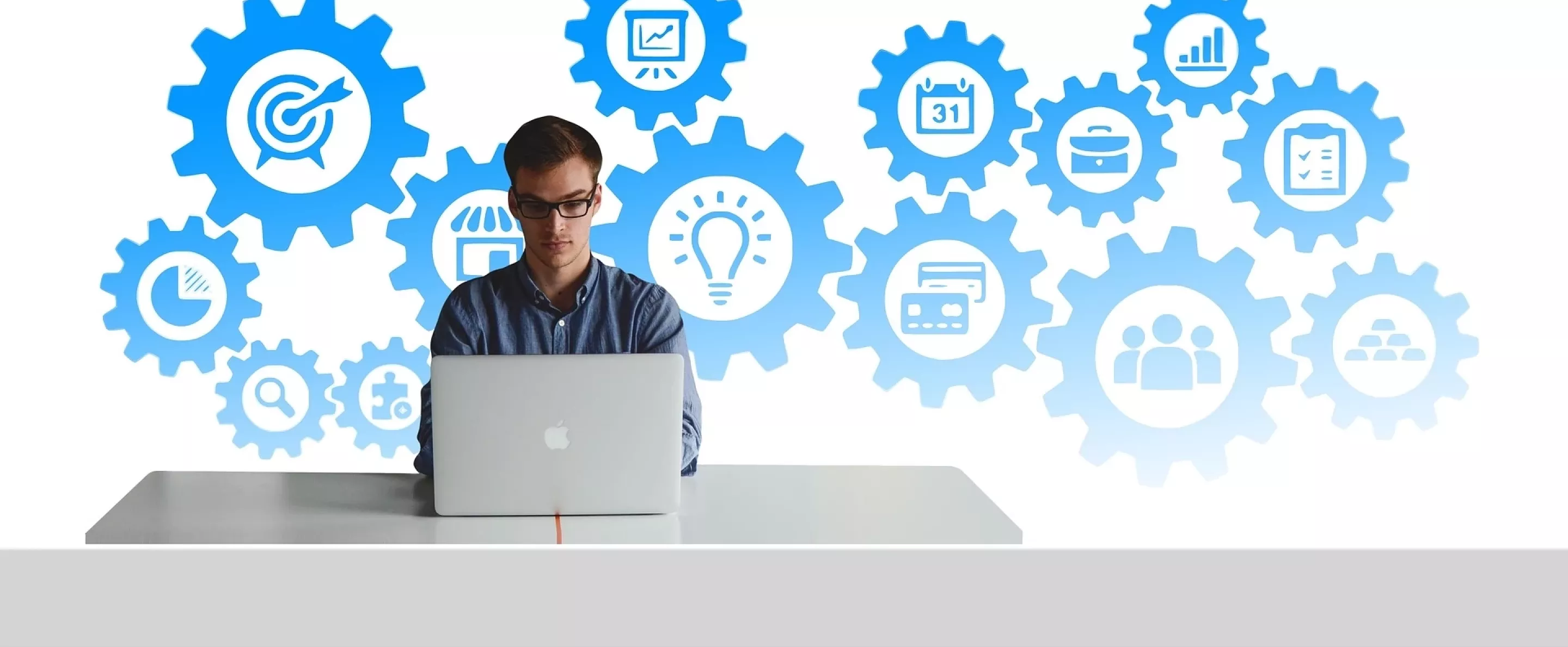 Entrepreneur sitting at computer with images representing processes. Image by Gerd Altmann from Pixabay