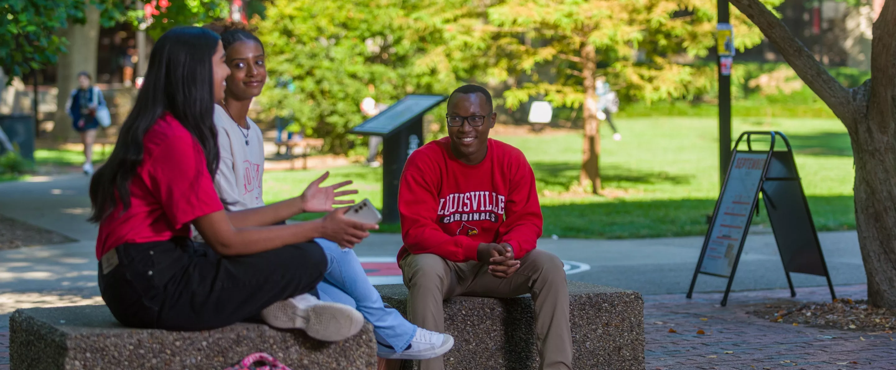 Students sitting and talking near the Ekstrom Library quad