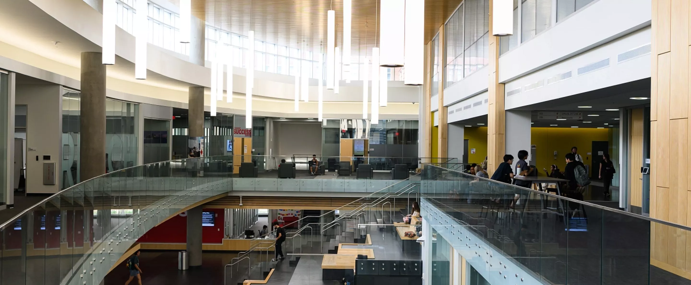 Students walking through the various levels of the Belknap Academic Building