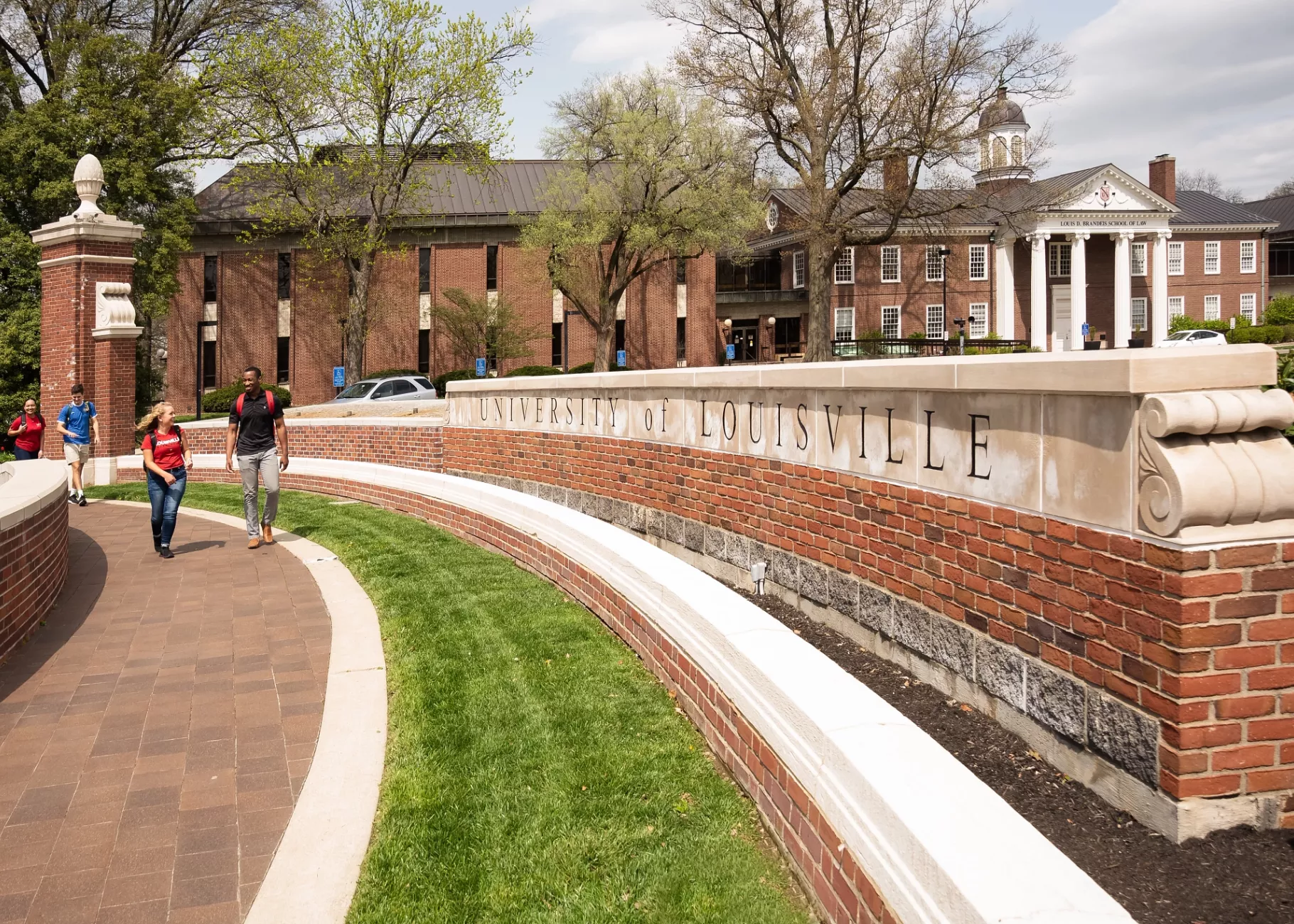 Students walking in front of Grawemeyer Hall oval