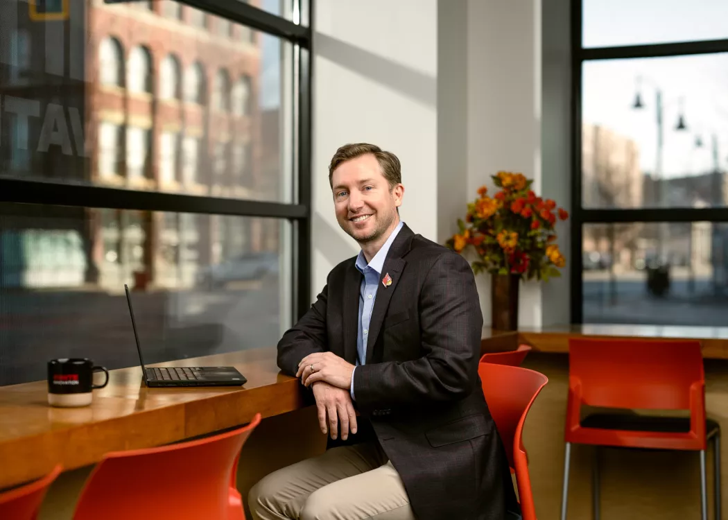 Will Metcalf sitting at a desk