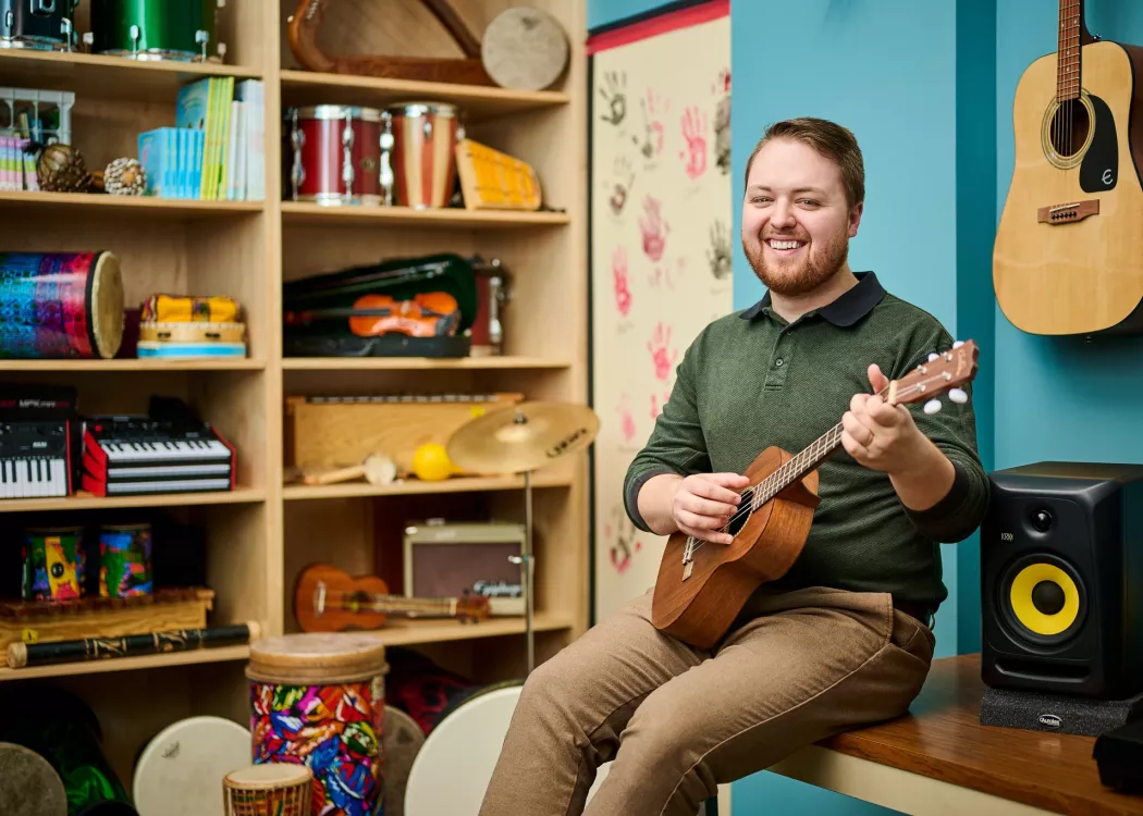 Portrait of Andrew Chapman in a music classroom environment
