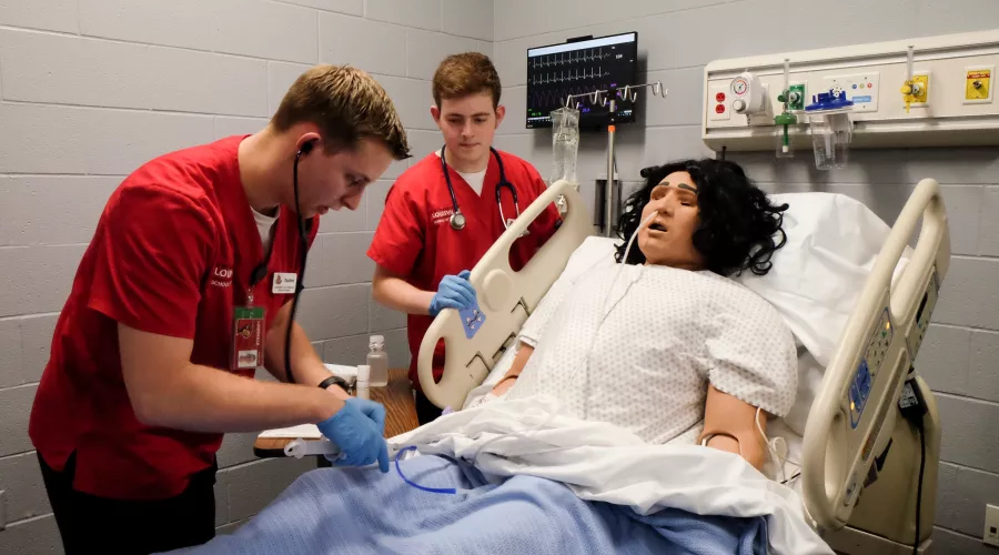 Two nursing students in the patient simulation lab